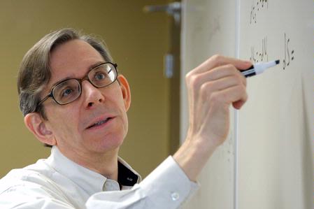 Dr. David Ward, professor of physics, teaches a class.  - Photo by Morris Abernathy