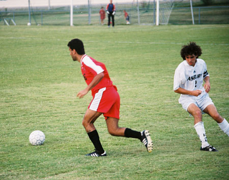Alexandre Pereira (16) takes the ball from the opponent and advances toward the goal. - Photo by Uncredited