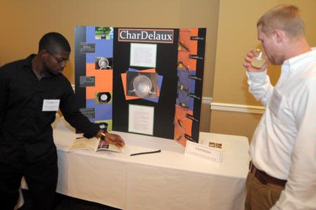 Engineering majors Tayo Adedokun and Rhett Woody prepare to present their semester long project for the annual scholarship symposium. - Photo by Morris Abernathy