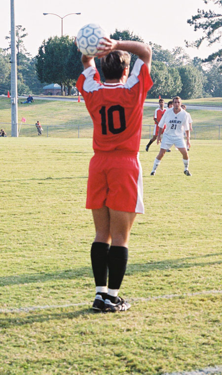 Kekec Zivkovic (10) on throw in.
 - Photo by Uncredited
