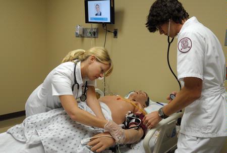 Nursing students work on simulations in Providence Hall. - Photo by Morris Abernathy