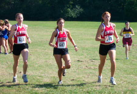 Kate Graham, Michelle Hardee, and Rachel Cazalas (L to R) warm-up before a cross country event. - Photo by Uncredited