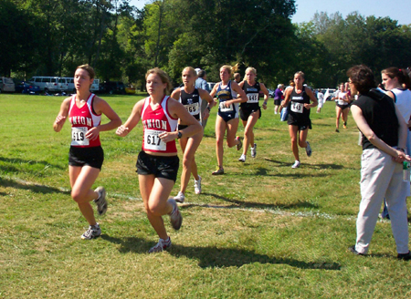 Union's top runners, junior Janelle Royer and freshman Jill Konkol lead this group of runners during a race. - Photo by Uncredited