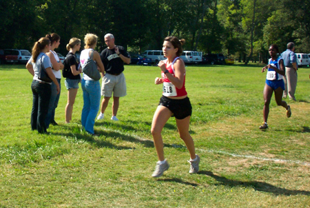 Courtney Owens runs alone during this portion of the race.
 - Photo by Uncredited