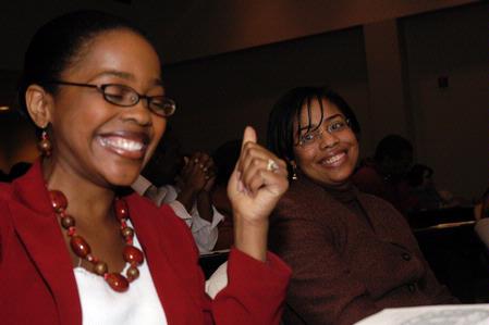 Jacqueline Taylor and Renee Jones enjoy the 2nd Annual Black History Month program. - Photo by Beth Spain