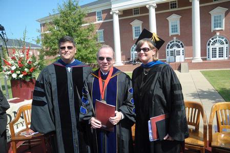 Dr. Dockery is joined by Dr. Carla D. Sanderson and Dr. Charles  A. Fowler at the summer commencement service. - Photo by Morris Abernathy