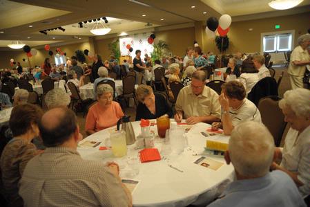 Guests at the Senior Adult Extravaganza enjoy some fun and fellowship in the Carl Grant Events Center. - Photo by Morris Abernathy