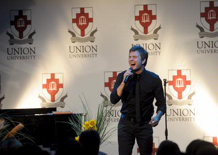 Travis Cottrell, Christian artist and worship leader at Englewood Baptist Church, provides the entertainment for the Faculty/Staff dinner.  - Photo by Morris Abernathy