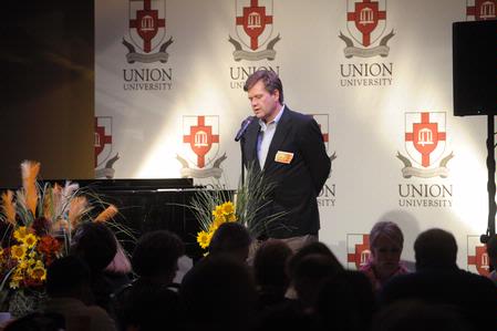 Dr. Gene Fant, dean of the college of arts and sciences, opens the Faculty/Staff dinner in prayer.  - Photo by Morris Abernathy