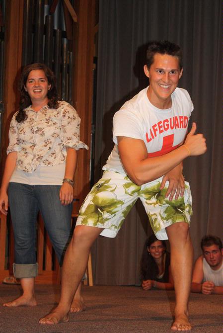 Brett Perkins, focus leader, entertains new students at the annual Focus Show by dressing like a lifeguard for a skit. - Photo by Ebbie Davis