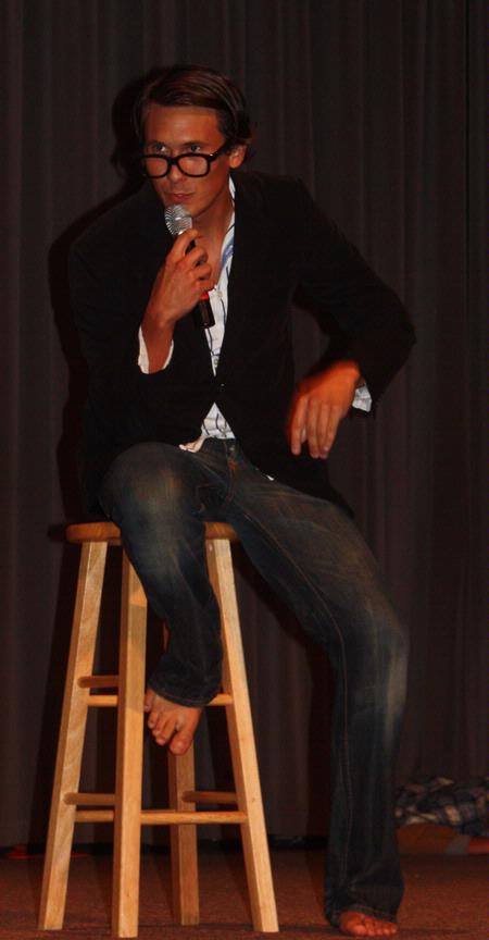 Micah Roeder, focus leader, entertains the new students at the annual Focus Show by performing in a skit as a game show host. - Photo by Ebbie Davis