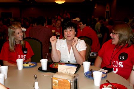 Ashley Blair, assistant professor of communication arts, laughs with incoming freshmen at the Dinner with your Department event. - Photo by Deanna Santangelo