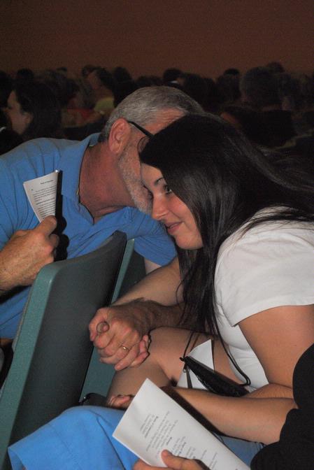 Kelsey Bell, incoming freshman, shares a moment with her father, Tony Bell, during the evening worship service for new students and their families.  - Photo by Victoria Stargel
