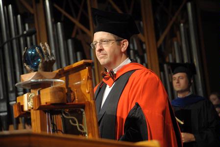 Ray Van Neste, director of the R.C. Ryan Center for Biblical Studies and associate professor of Biblical Studies,  bears the mace as the current faculty member of the year.  - Photo by Morris Abernathy