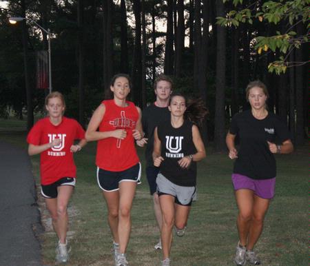 The Women's Cross Country team prepares for their Fall 2010 season.  - Photo by Ebbie Davis
