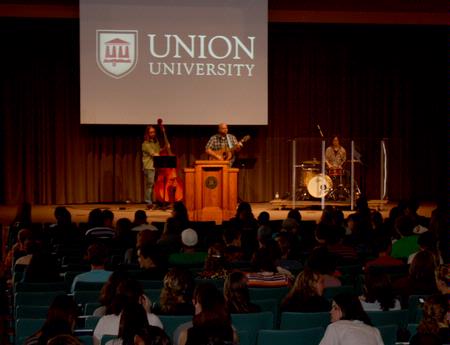 Russ Pflasterer, pastor of City Fellowship in Jackson, Tennessee, leads music during chapel. - Photo by Ebbie Davis