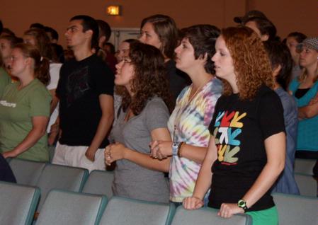 Katherine Crutcher, Kristen Marks, and Michele Marks enjoy a time of worship during chapel. - Photo by Ebbie Davis