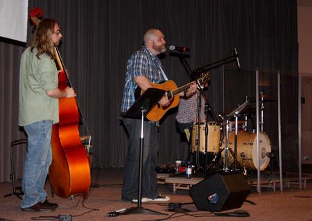 A group from City Fellowship, led by pastor Russ Pflasterer, leads music during chapel. - Photo by Ebbie Davis