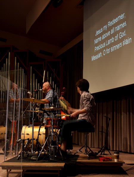 A group from City Fellowship, led by pastor Russ Pflasterer, leads music during chapel. - Photo by Ebbie Davis