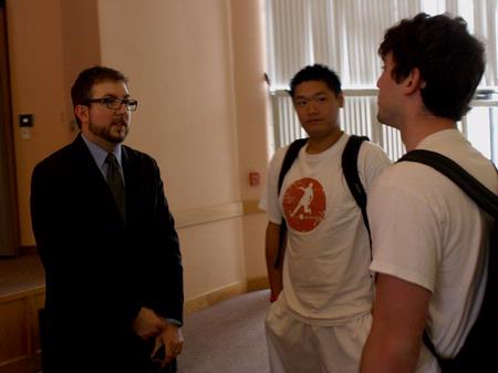 Taylor Worley, associate dean for spiritual life and assistant professor of Christian thought & tradition, speaks with Kevin Ung, senior sport management major, and Phillip Johnson, junior engineering major, after his sermon in chapel.  - Photo by Ebbie Davis