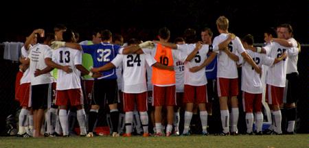 The Bulldog soccer team gathers together for prayer before their game against Delta State. The Bulldogs won the game 3-0. - Photo by Ebbie Davis