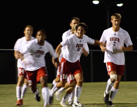 The men's soccer team celebrates after a goal against Delta State. The Bulldogs won the game 3-0. - Photo by Ebbie Davis