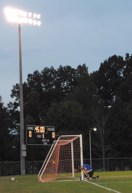 J. Landham kneels by the goal before the Bulldogs take on Truett-McConnell College. The Bulldogs won the game 2-0. - Photo by Victoria Stargel