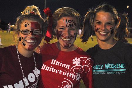 Union fans Hannah Mahoney, sophomore nursing major, Bekah Kind and Rebecca Thomas, both sophomore elementary education majors, get decked out in support of the Bulldog Soccer Team. - Photo by Victoria Stargel