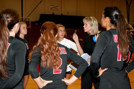 Head coach Kelly Elliot strategizes with the Lady Bulldog volleyball girls during a time out against Martin Methodist. Union won 3-1. - Photo by Deanna Santangelo