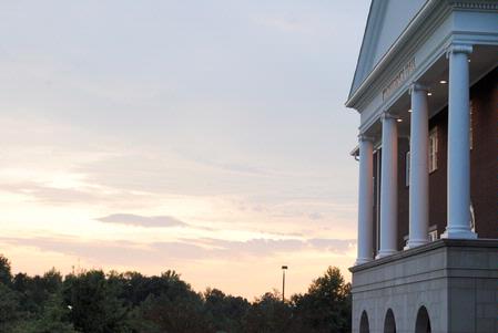 The sun sets behind Providence Hall. - Photo by Victoria Stargel