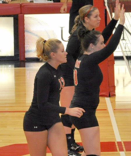 Heather Lieberman (top), Shelby Swink and Caroline Robbins prepare to block the opponent's attack. - Photo by Steven Aldridge