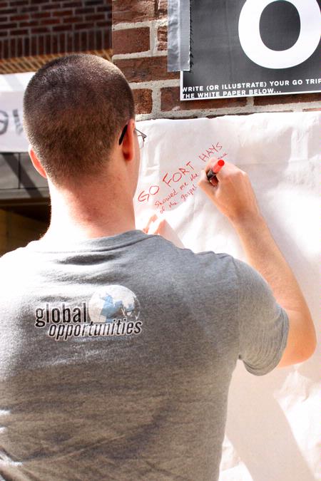 As GO Week kicks off on Union's campus Sam Dahl, senior Christian ethics major, gears up for the week by writing down a memory from his GO trip. - Photo by Ebbie Davis