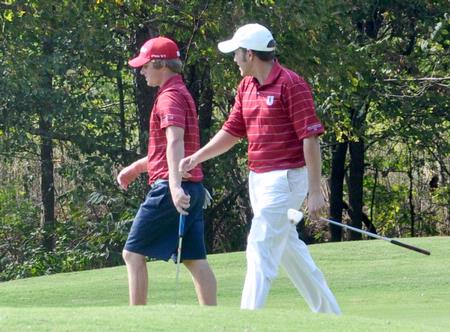 Josh Bratcher (right) and Matt Kelley talk during a round of golf. - Photo by Steven Aldridge