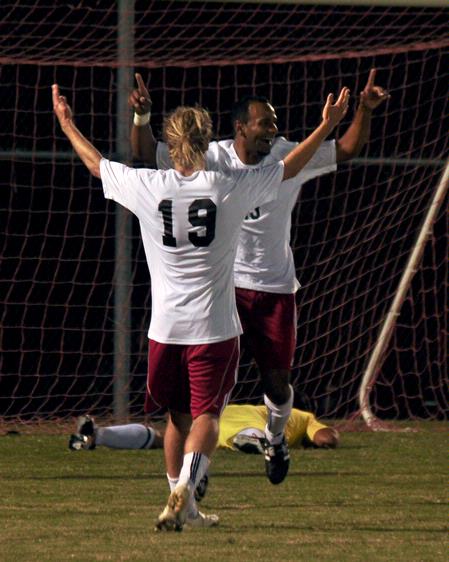 William Hanna (19) and Diego Santos celebrate a goal. - Photo by Meagan Comeaux