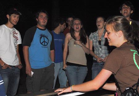 Anna Lewis, freshman, plays a song on the keyboard as a crowd begins to gather and sing along after Res Life's Progressive Snacking event. - Photo by Victoria Stargel