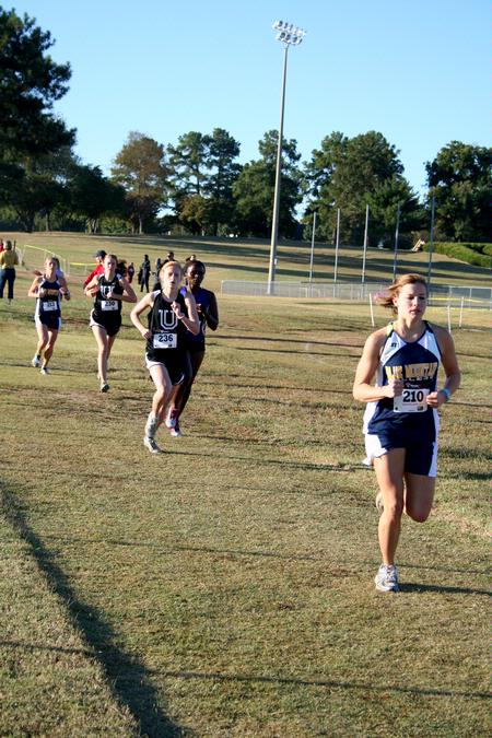 The women's cross country team competes in a meet on campus.  - Photo by Deanna Santangelo