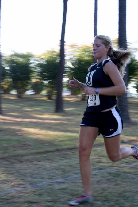 Hannah Clardy, senior Biblical Studies major, runs across campus during a women's cross country meet.  - Photo by Deanna Santangelo
