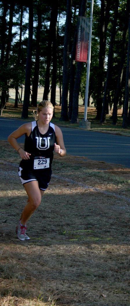 Hannah Clardy, senior Biblical studies major, runs in a meet on Union's campus.  - Photo by Deanna Santangelo