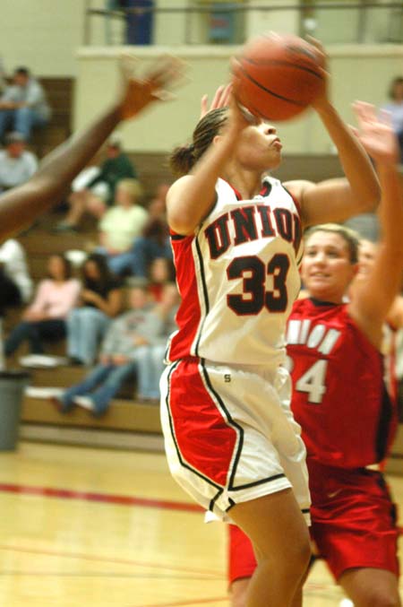 Stephanie Clark (33) tries for a score on teammate Molly York (34) during the Bulldog Madness scrimmage game. - Photo by Courtney Ross