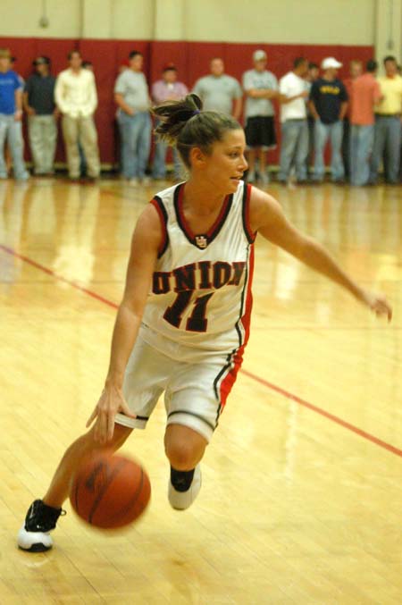 Sophomore guard Jennifer Henson drives to the basket in the scrimmage game during Bulldog Madness. - Photo by Courtney Ross