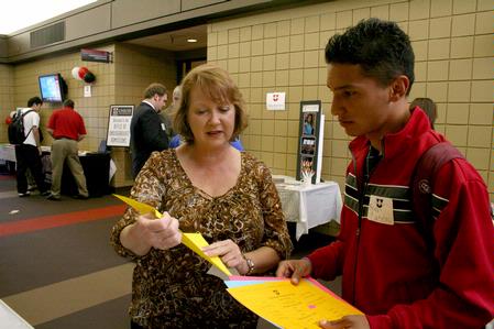 Jinni Leigh Blalack, associate professor of psychology, talks to Brian Castro, freshman athletic training major, at the annual Career "U"niversity, hosted by Career Services.  - Photo by Deanna Santangelo