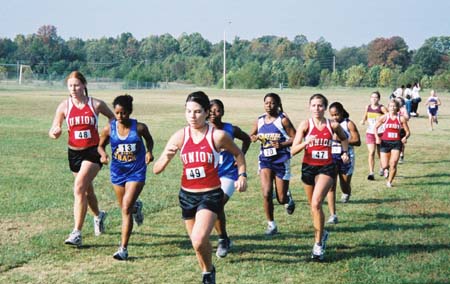 Rachel Cazalas, Cortney Owens, Michelle Hardee (Gilmore), and Adrienne Briles run in the Univ. of Tennessee-Martin Invitational. - Photo by Uncredited