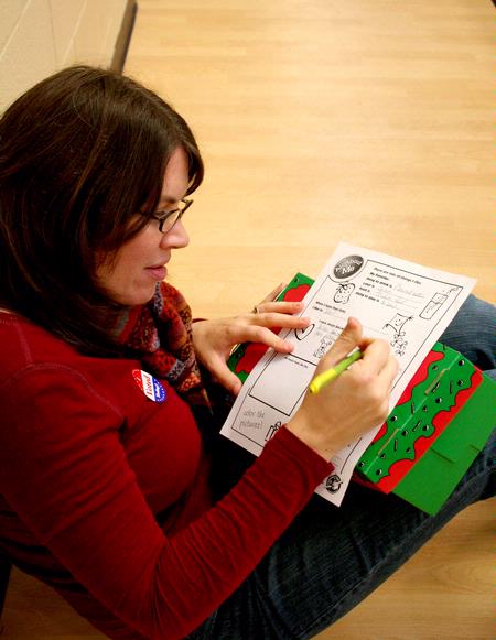 Lesley Guilaran, special programs academic liaison, fills out an activity for her Operation Christmas Child box during Campus and Community Day. - Photo by Deanna Santangelo