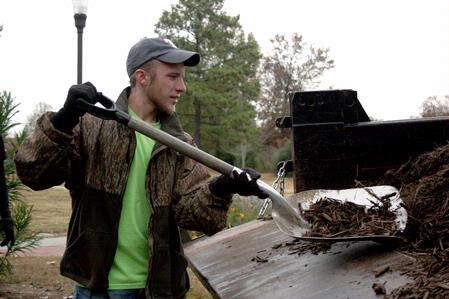 Todd Jones, freshman engineering major, volunteers at Liberty Garden Park for the annual Campus and Community Day. Jones and other Union students helped out by shoveling and laying mulch.  - Photo by Ebbie Davis