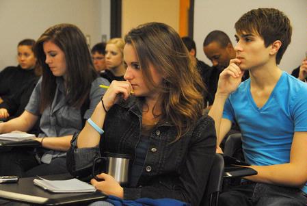 Kylie McDonald, sophomore political science major, Amanda Parrish, junior journalism major, and Alex Green, senior broadcast journalism major, listen as a panel of Union political science professors discuss the results of the mid-term election. - Photo by Victoria Stargel