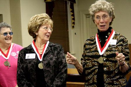Carolyn Townsend McAfee, alum 1961, laughs at a story that Pat Anderson Howerton, alum 1961, tells in the old chapel that now serves as a courtroom. The class of 1961 came back to Union and toured the old campus for their 50th reunion during homecoming weekend. - Photo by Deanna Santangelo
