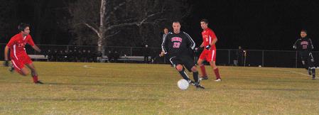 Dejan Kostic dribbles around Lyon players in an exciting game that ended in a first-level TranSouth Conference tournament victory of 6-5 after overtime and a shootout. - Photo by Victoria Stargel