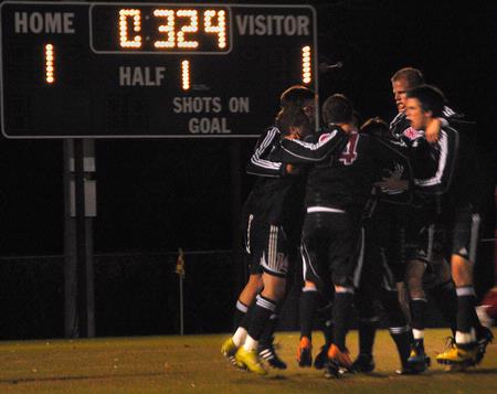 Union Bulldogs celebrate together after scoring just before the half. The game ended in a rousing first-level TranSouth Conference Tournament victory of 6-5 after overtime and a shootout. - Photo by Victoria Stargel