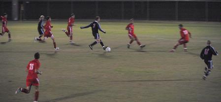 Taylor Mayo dribbles his way through his Lyon College opponents. The Bulldog Soccer team won the first-level  of the TranSouth Conference Tournament with a score of 6-5 after overtime and a shootout. - Photo by Victoria Stargel