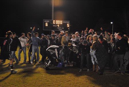 After overtime and a shootout, Union fans rush the field in celebration of the 6-5 victory over Lyon College in the TranSouth Conference Tournament first round.  - Photo by Victoria Stargel